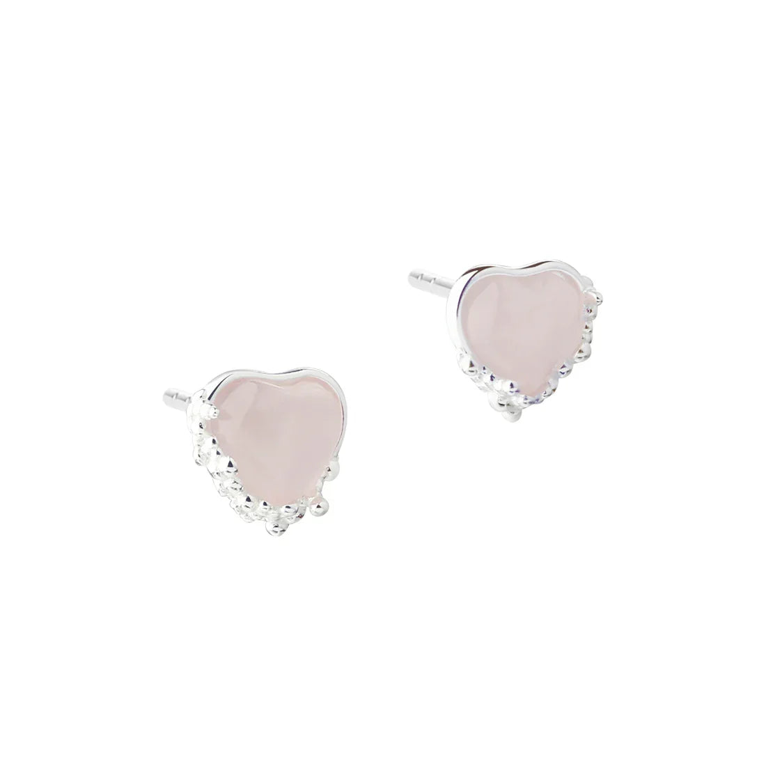 Hartvormige oorbellen in zilver met roze stenen, vooraanzicht van de sieraden per paar