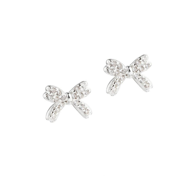Aqua Dulce Darling Bow oorbellen zilver, fijne strikvormige studs met fonkelende steentjes. Model 5697-1.