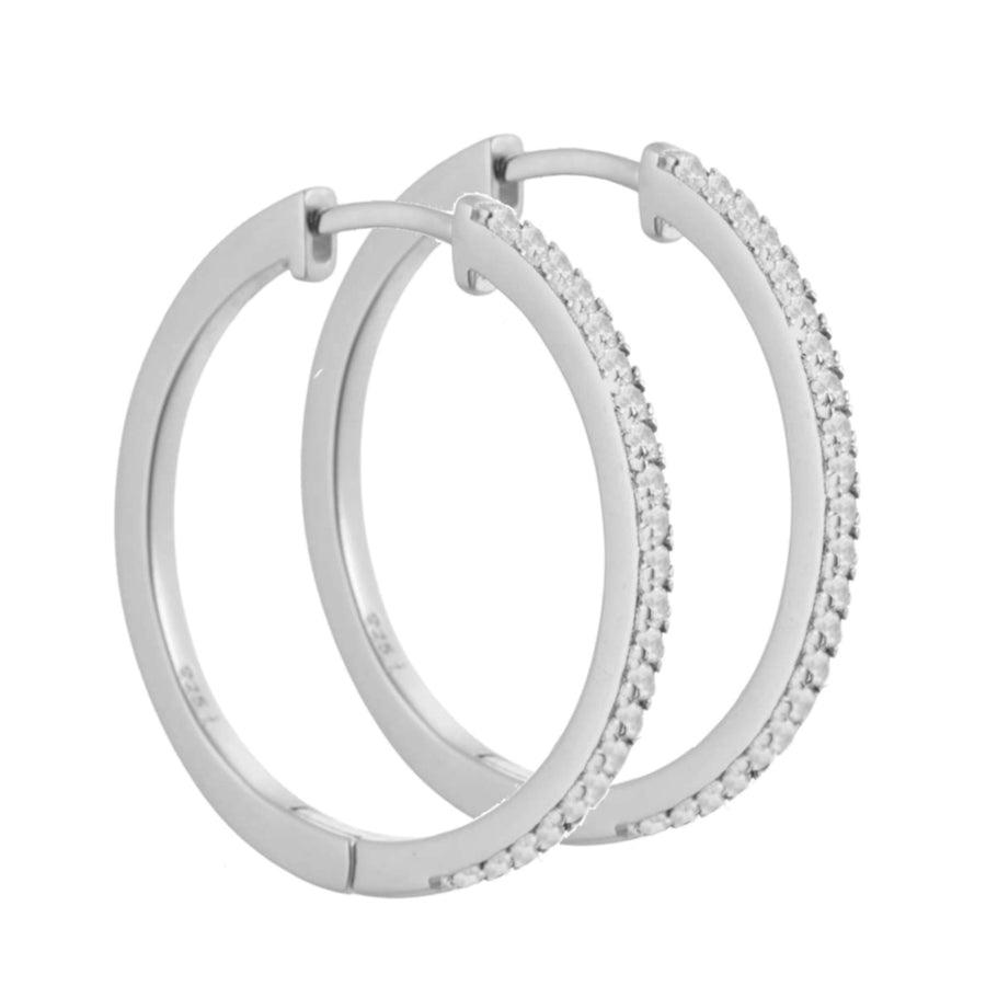 Aqua Dulce Raya Creol 925 sterling zilver verschijnt als elegante oorbellen in zilver met kleine heldere steentjes. Model 4549-4549-1