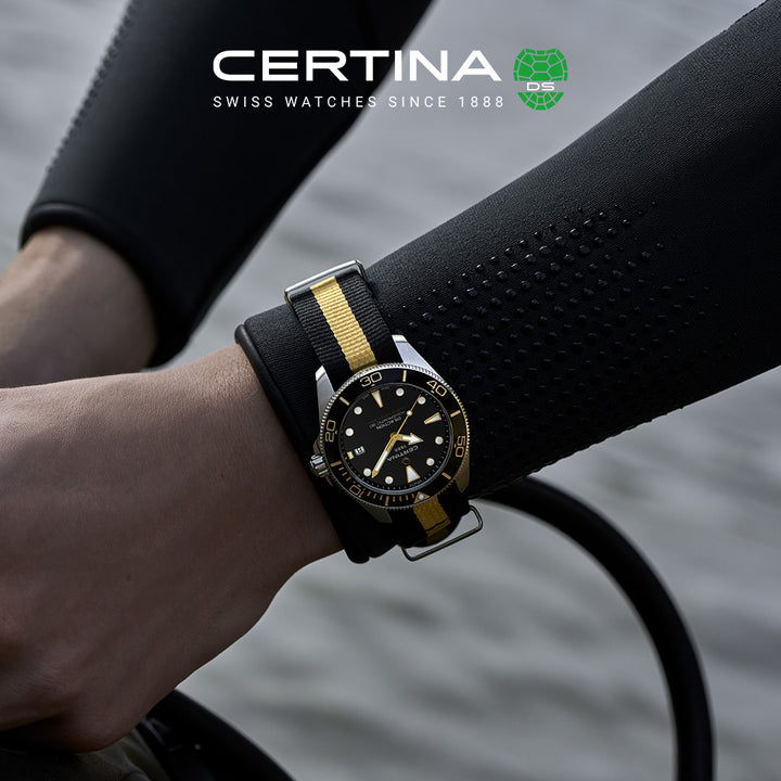 Certina DS Action Diver 40 mm Powermatic 80 op zwart-gele NATO-band gezien om de pols, model C0484071805101