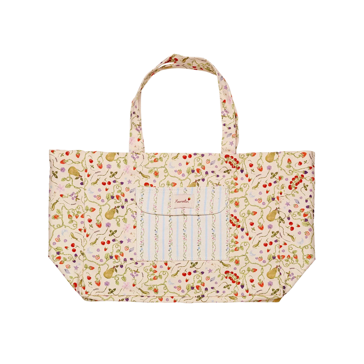 maanesten-big-canvas-tote-garden-magic-ivory toont een grote beige canvas draagtas met kleurrijk bloemenpatroon en voorvak. Model 4122-1