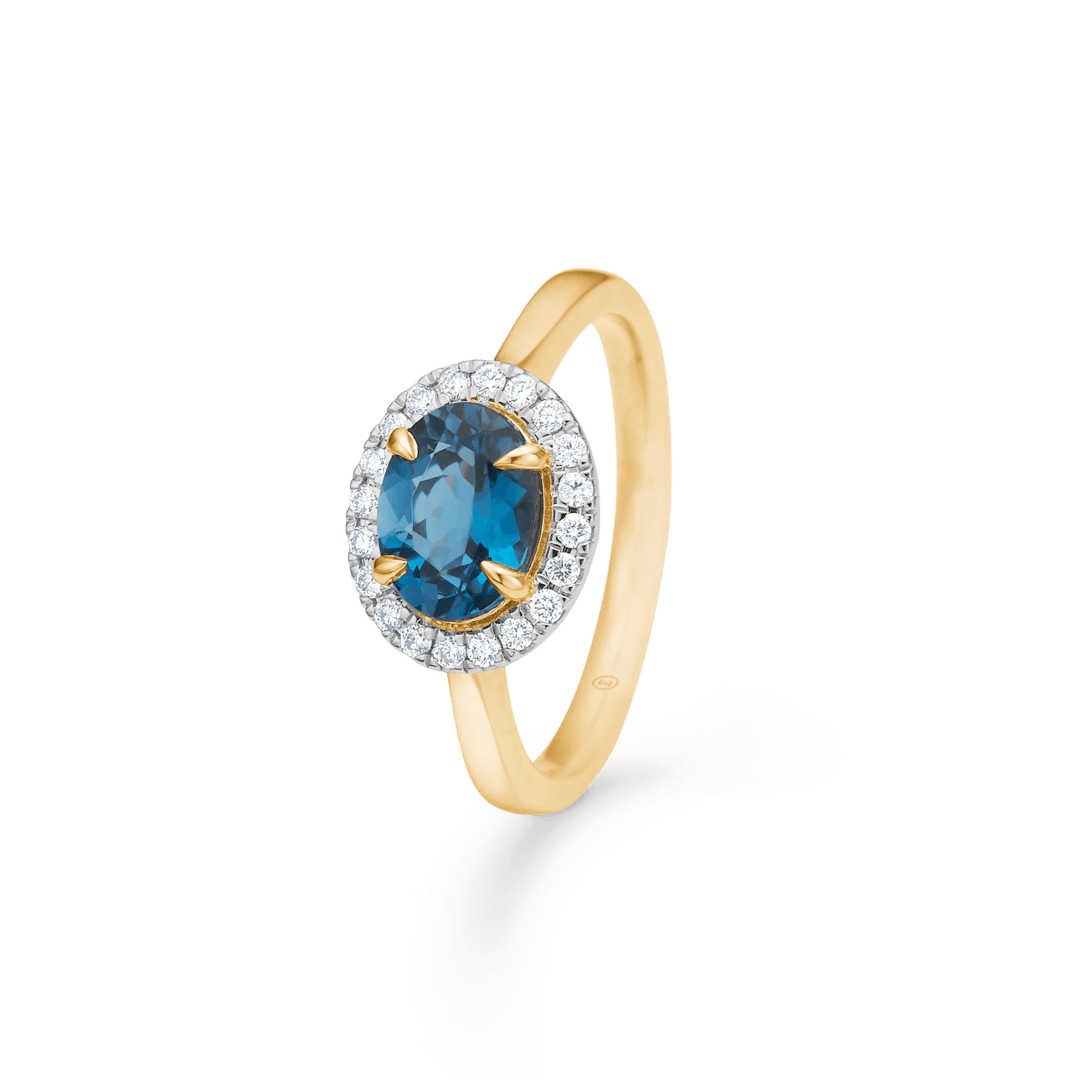 Verlovingsring van 14 kt goud met blauwe topaas en diamanten