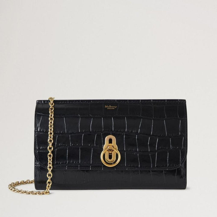 Mulberry Amberley Clutch Black Shiny Small Croc, elegante zwarte clutch van glanzend krokodillenreliëfleer met gouden ketting en draaisluiting. ModelRL8191641A100.