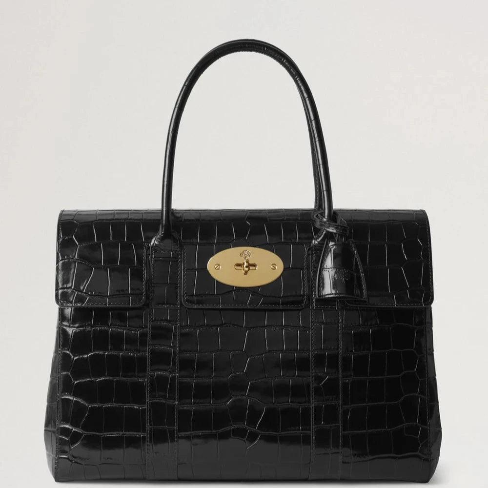Mulberry Bayswater Croc Black toont een elegante zwarte handtas van leer met krokodillenreliëf en een gouden sluiting. ModelHH9589641A100