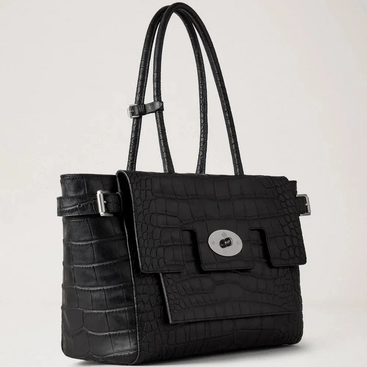 Mulberry Gesp Bayswater NVT De Croc is uitgevoerd in zwart leer met reliëf en een zilveren gesp. ModelHH9957741A100.