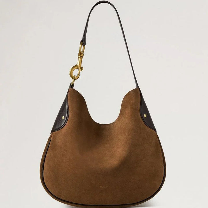 Mulberry Hackney Schoudertas vintage eiken suède met ronde vorm, donkere details en gouden hardware. Modelhh9956047g924