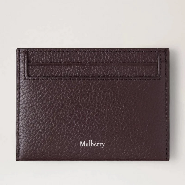 Mulberry Heritage Creditcard Slip Small Classic Grain Ebony heeft een donkerbruine leren creditcardhouder met logo. ModelRL4064205A110