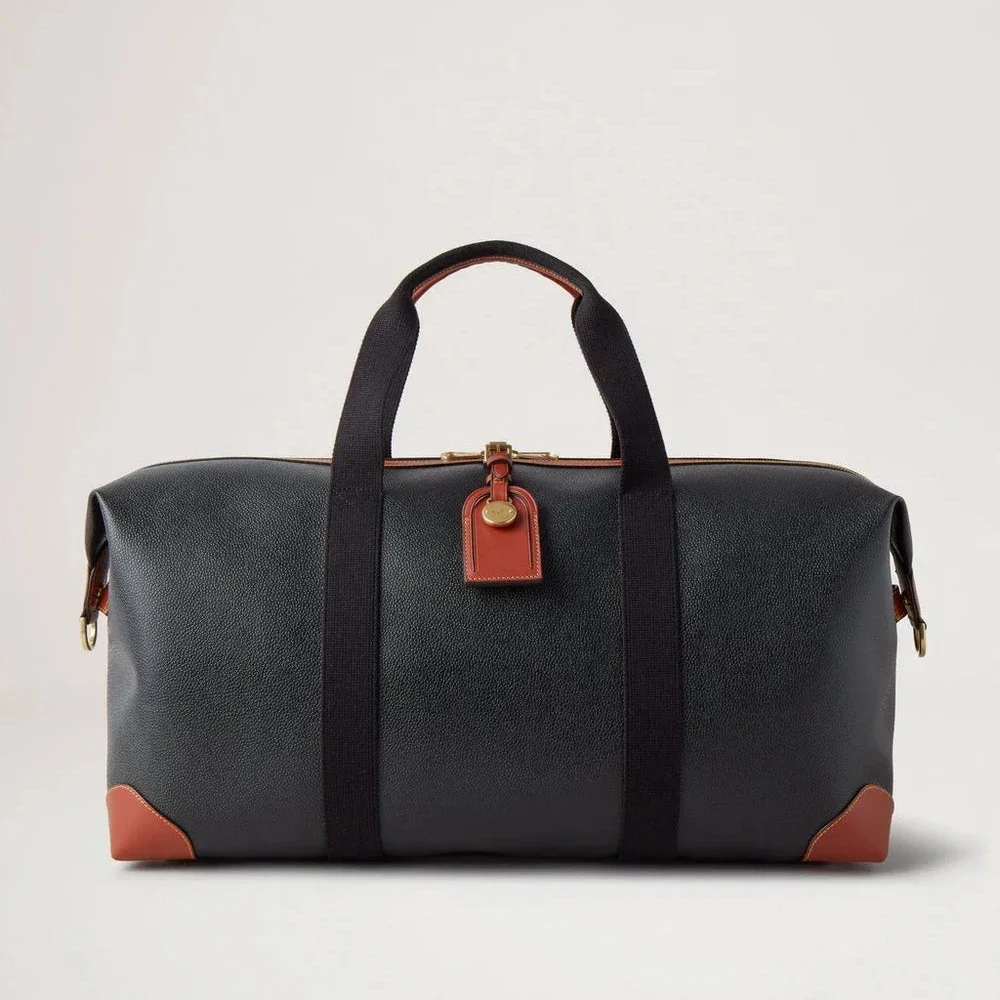 Mulberry Heritage Medium Clipper in zwart en cognac scotchgrain met leren details aan de voorkant. ModelHL5136127A340