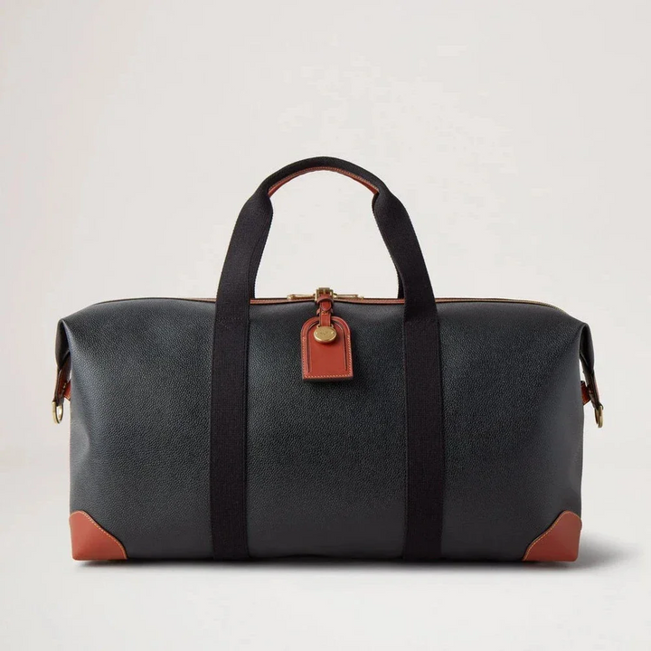 Mulberry Heritage Medium Clipper in zwart en cognac scotchgrain met leren details aan de voorkant. ModelHL5136127A340