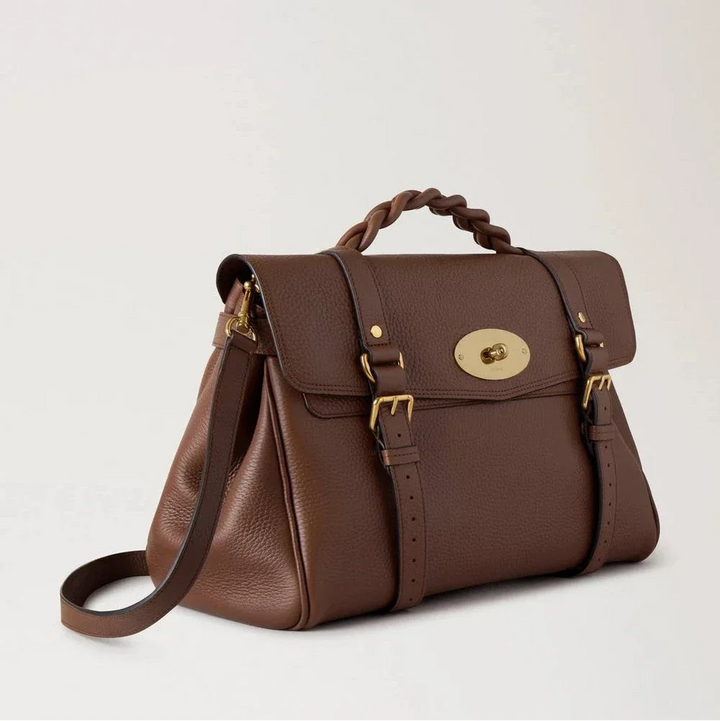 Mulberry Oversized Alexa Bright Oak Heavy Grain toont een ruime bruine leren tas met gevlochten handvat en gouden details. ModelHH6884736G222