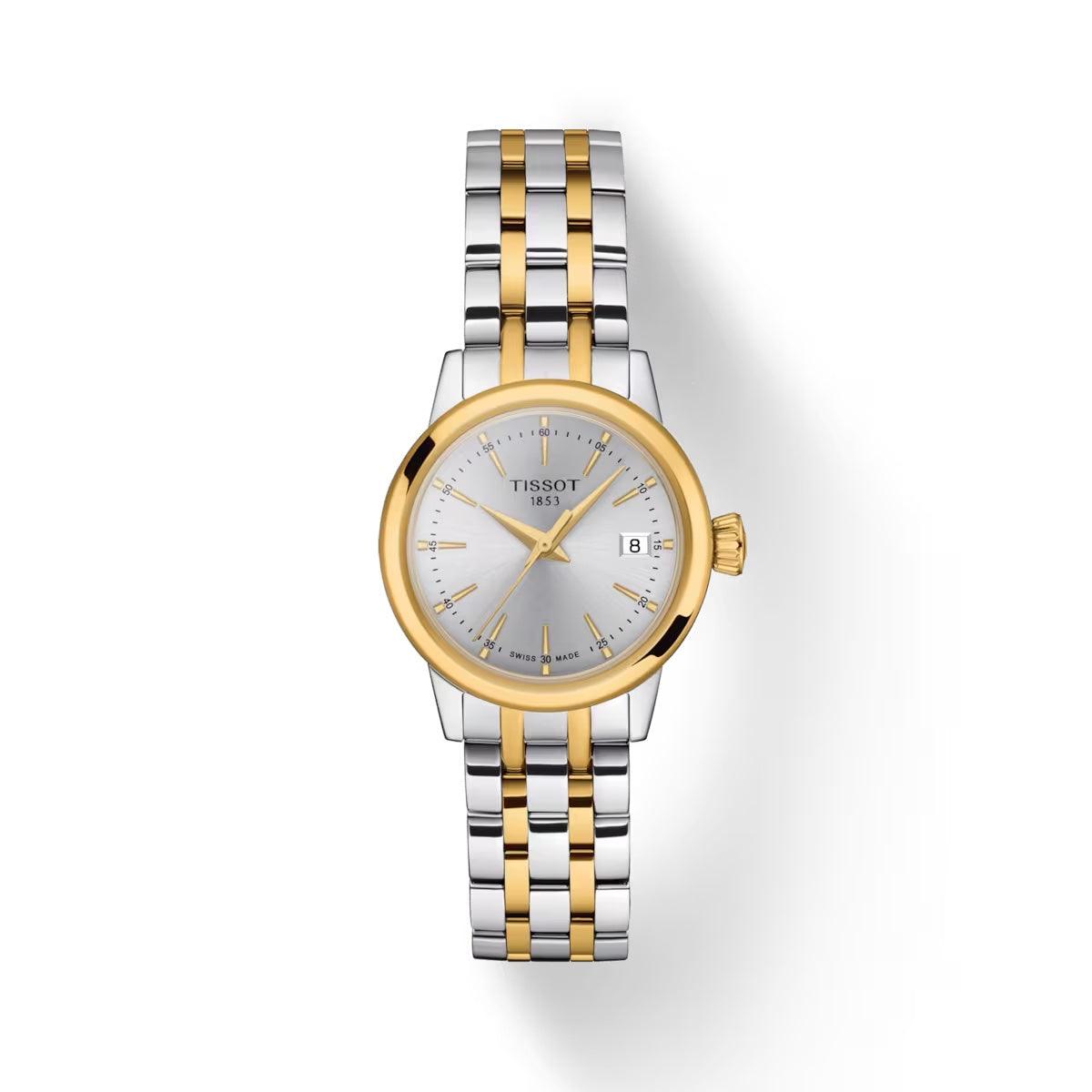 Tissot Classic Dream Lady goud PVD toont elegant tweekleurig dameshorloge met zilveren wijzerplaat en datum. ModelT1292102203100