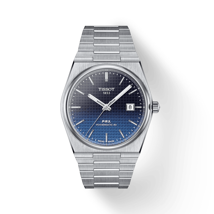 Tissot PRX Powermatic 80 40 mm heeft een blauwe wijzerplaat, stalen band en datumweergave. ModelT1374071105101
