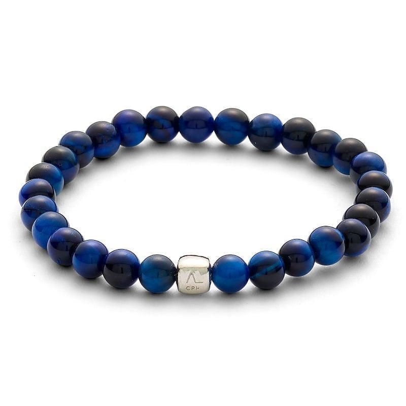 Alexander Lynggaard Armband Blauw Tijgeroog 6mm met ronde blauwe kralen en zilveren detail. Modelc00783-001.