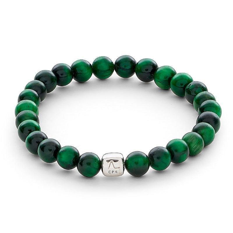 Alexander Lynggaard Armband Groen Tijgeroog 6mm toont een elastische armband met groene tijgeroogkralen en een zilverkleurig detail. Modelc00353-001-1